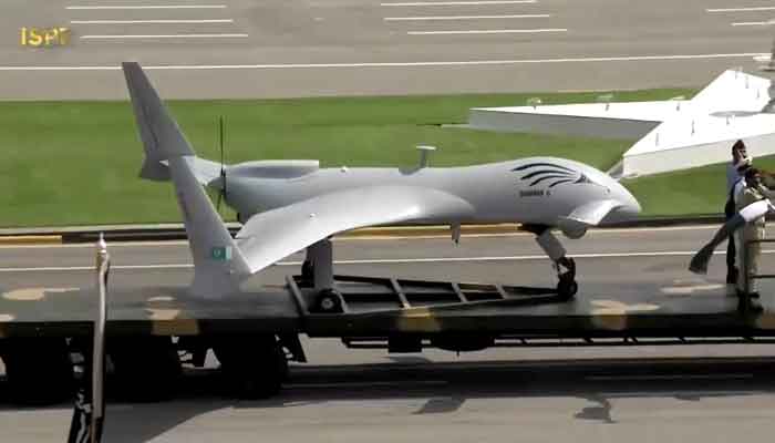 A modern drone is demonstrated during a military parade.