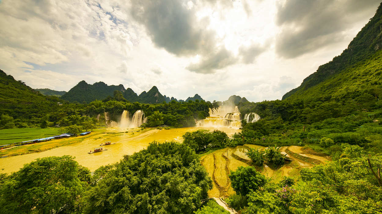 Asia's largest cross-border waterfall turns golden