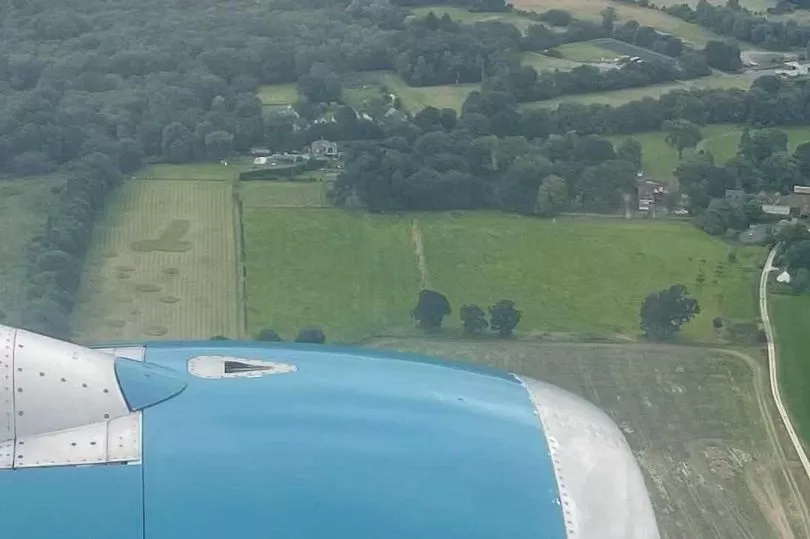 Passengers on the plane were left with a cheeky message in the field by a farmer, causing an explosion of laughter