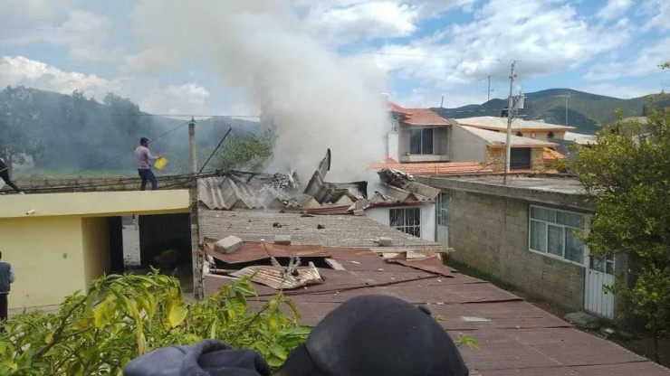 Private plane crashes into residential buildings in Mexico